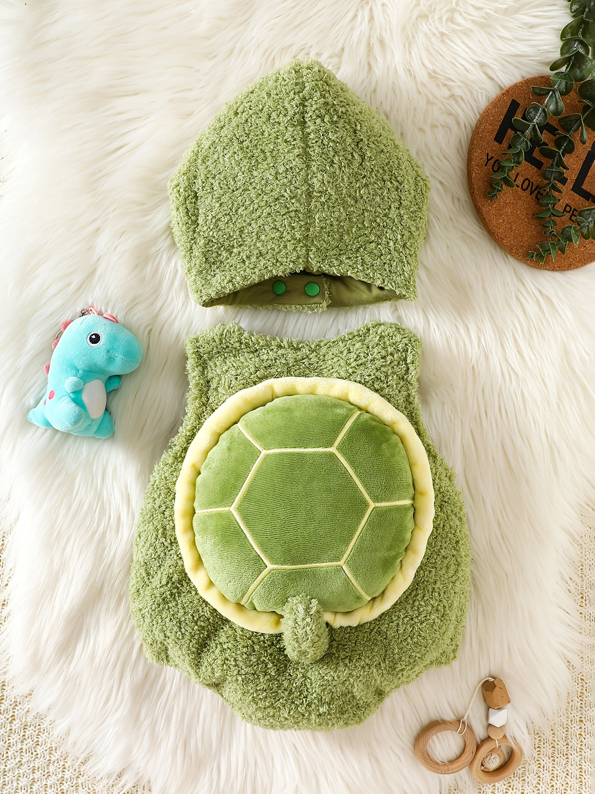 Adorable Turtle Romper Set, Paired with a Matching Cute Turtle Hat and Sleeveless Onesie. The Turtle Shell Design on the Back Adds a Playful Touch. Made from Warm, -friendly Fabric with a Loose Fit for Comfortable Movement. Features Snap Buttons